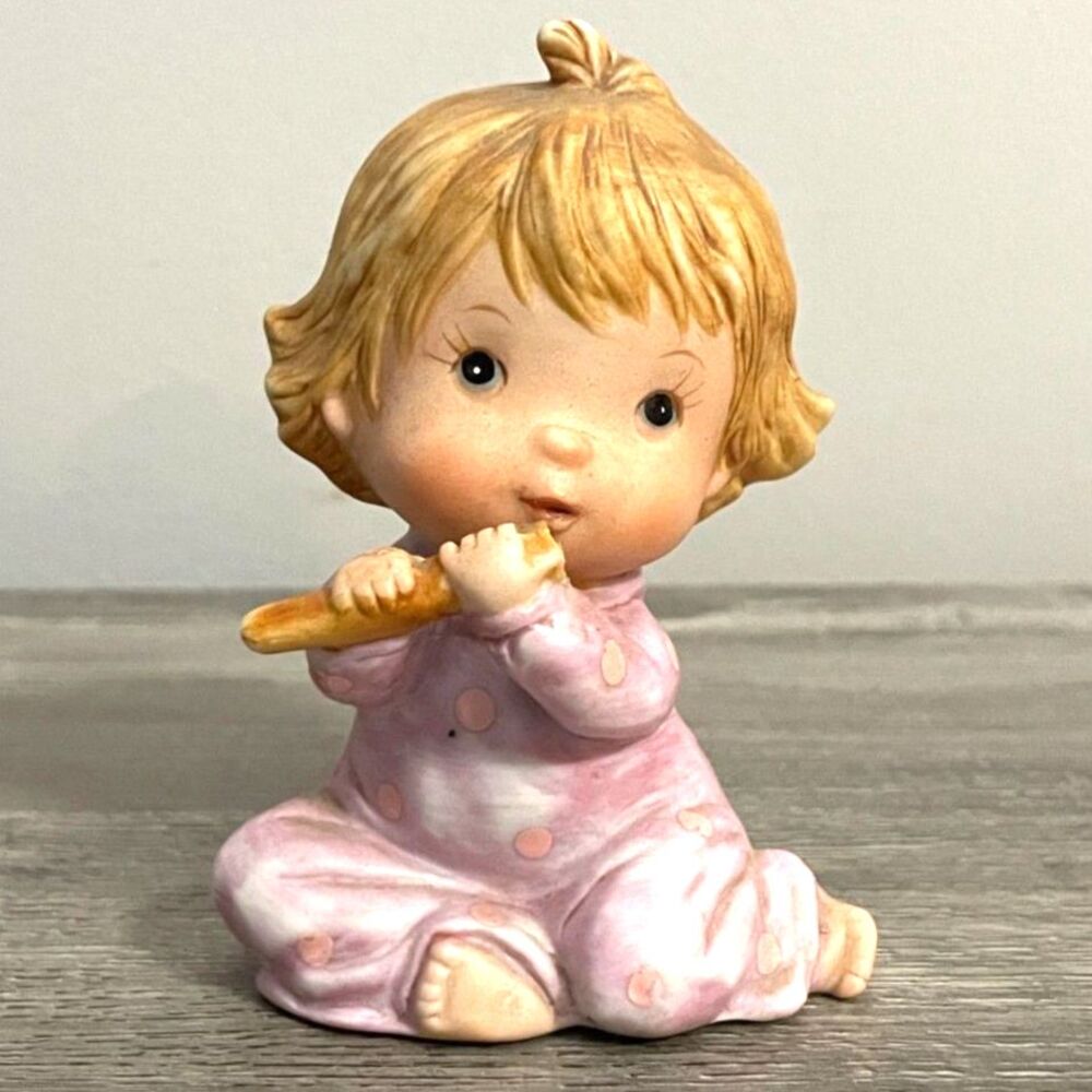 Vintage Porcelain Baby Figurine with Breadstick – Pink Polka Dot Pajamas